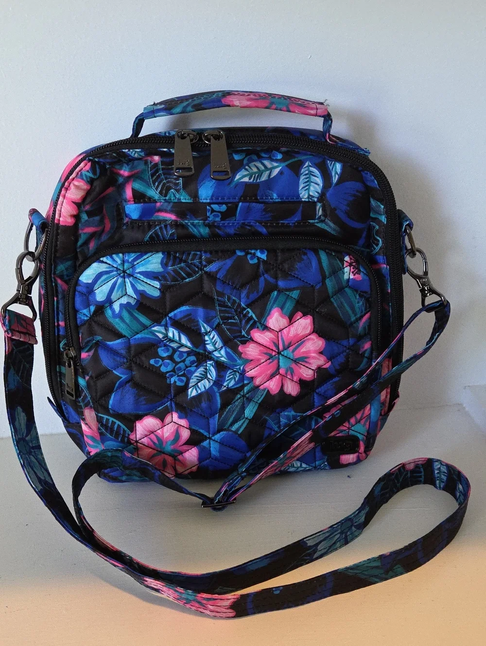 Lug Ranger 2 crossbody bag in the Resort Black floral pattern.